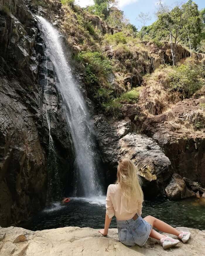 The waterfall flows into an impressive clear lake.