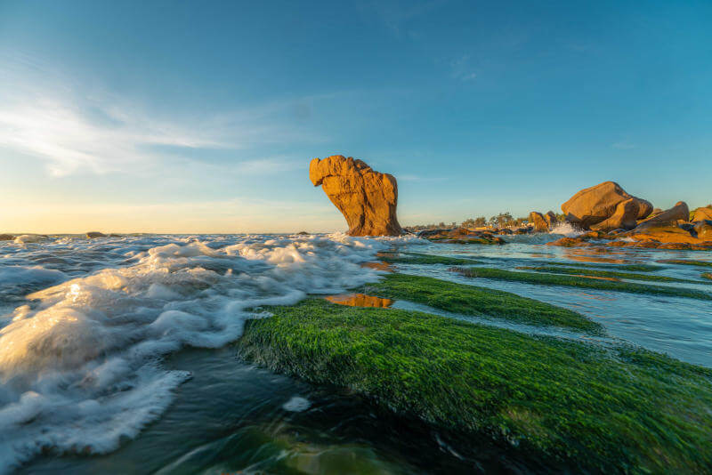 Colorful Pebbles and Mossy Rocks: The Allure of Co Thach Beach