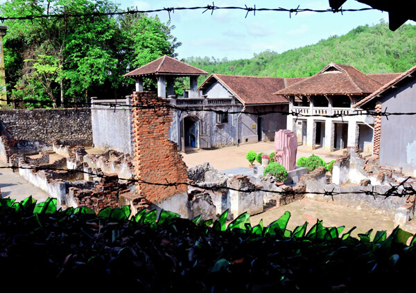 The prison is surrounded by barbed wire and jagged glass.