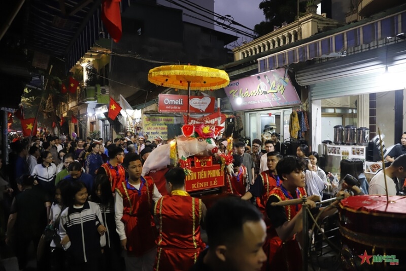 Festival procession of "man pig" in La Phu village