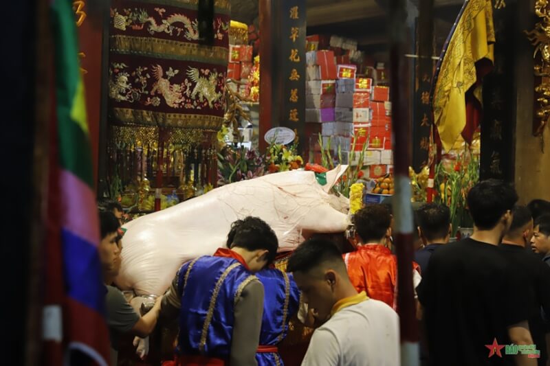 Festival procession of "man pig" in La Phu village