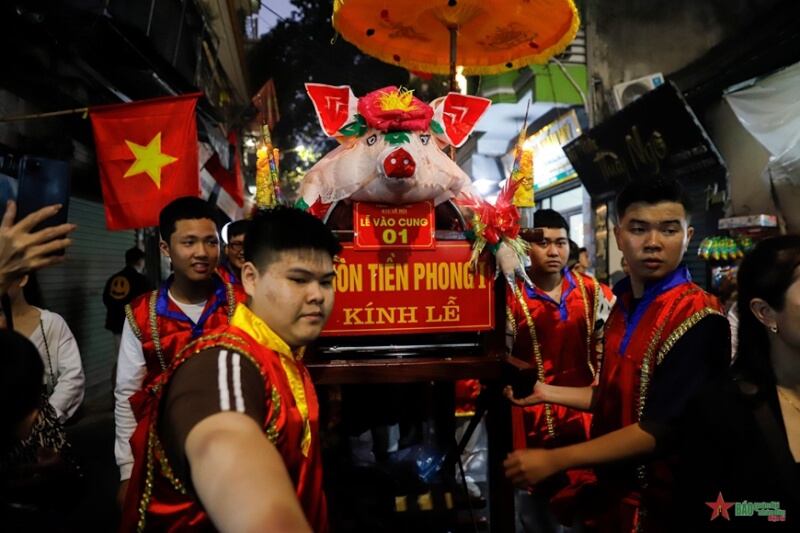 Festival procession of "man pig" in La Phu village
